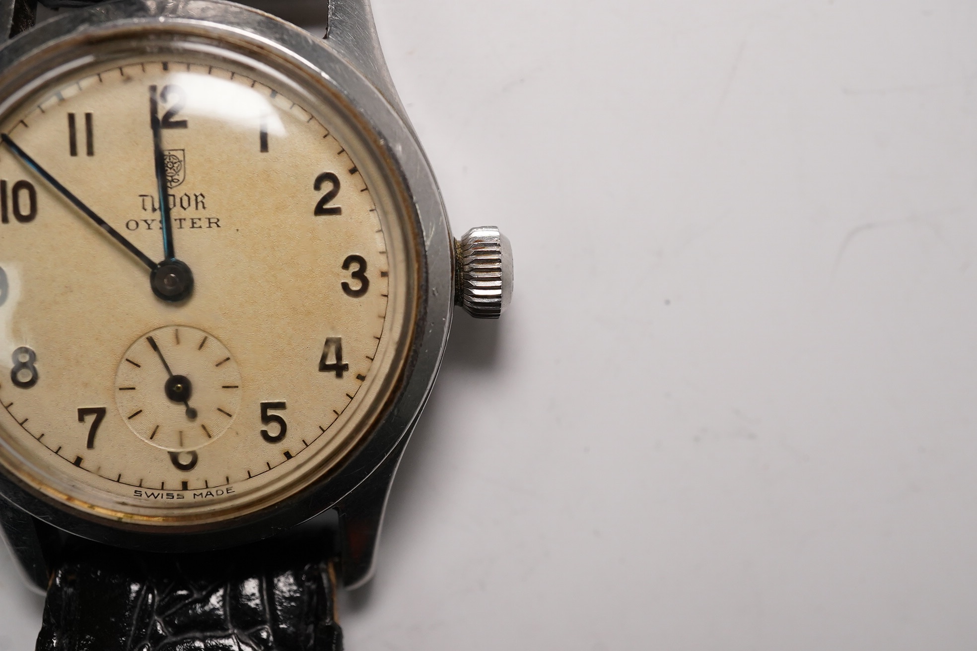 A stainless steel Tudor Oyster manual wind wrist watch, on an associated strap, case diameter 31mm. Condition - poor to fair